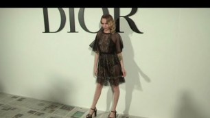 'Cara Delevingne pose for the photographers at the Dior Fashion show in Paris'